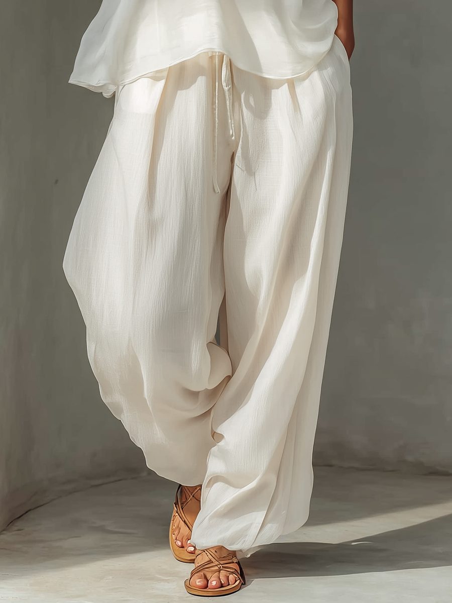 Sleeveless chiffon top from a women's wide leg trousers set. Elegant resort wear & casual summer fashion.