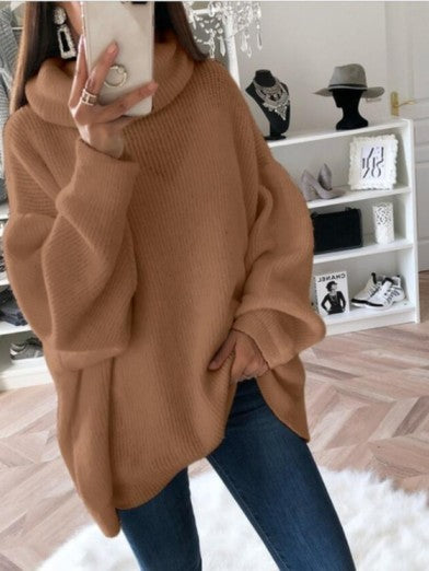 Women's chunky cable knit turtleneck sweater in cream, perfect for cozy winter wear.
