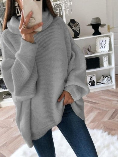 Close-up of a soft women's turtleneck sweater showcasing intricate cable knit detailing.