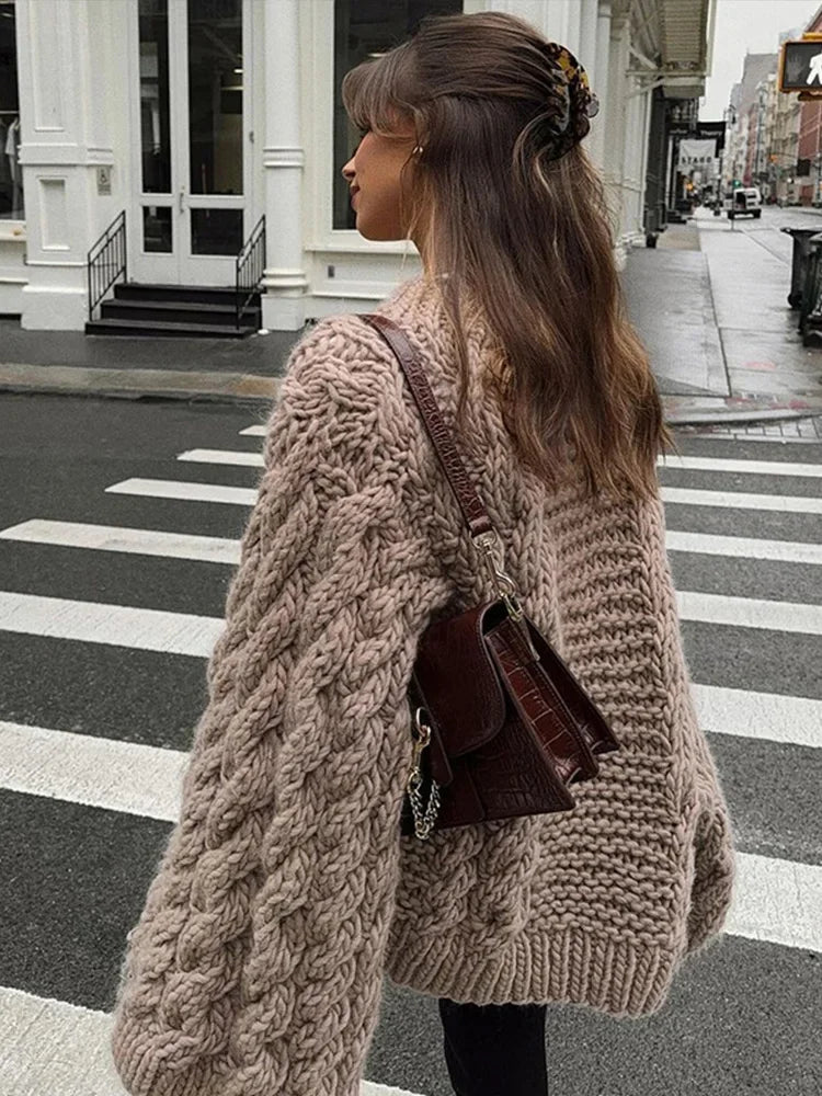 Cozy women's oversized chunky knit sweater with long sleeves, ideal for comfortable daily wear and relaxed styling.
