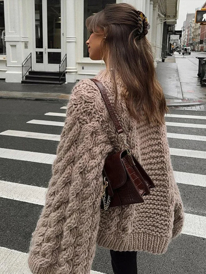 Cozy women's oversized chunky knit sweater with long sleeves, ideal for comfortable daily wear and relaxed styling.