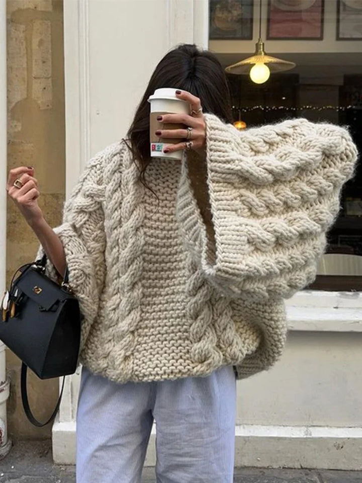 Stylish women's chunky knit sweater, oversized and cozy, featuring a relaxed fit for ultimate winter comfort.