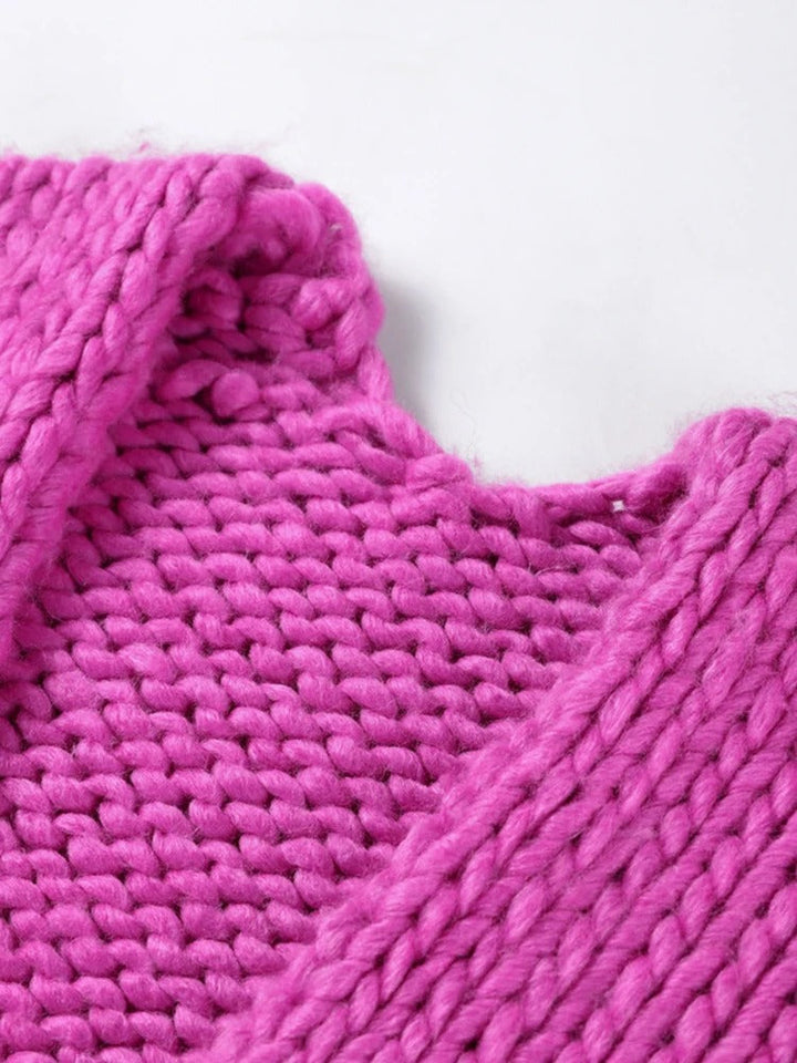 Comfortable women's chunky knit V-neck cardigan. Soft, loose fit, ideal for fall & winter style.