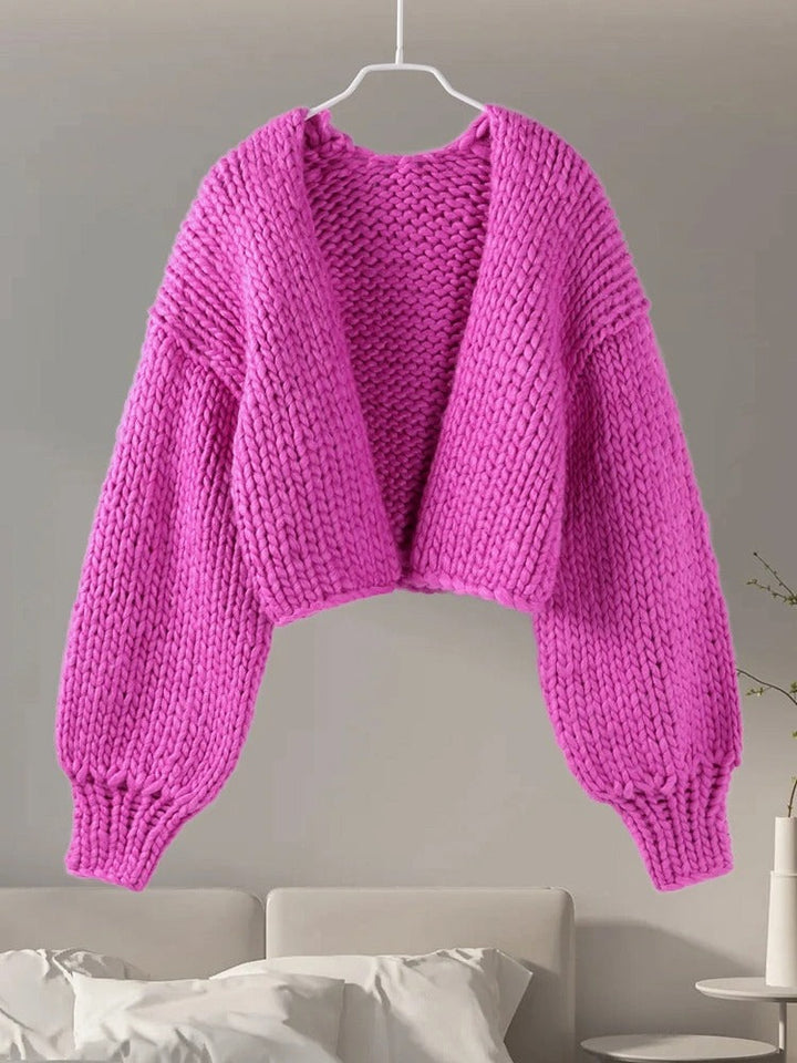 Women's warm chunky knit V-neck cardigan. Loose fit, soft stretch knitwear for cozy winter fashion.