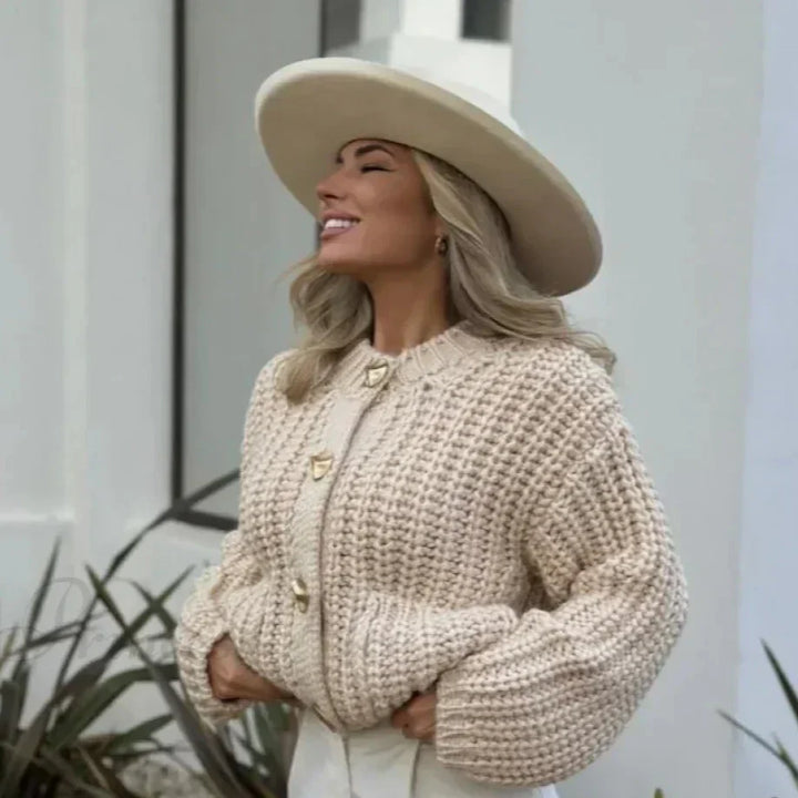 Versatile women's V-neck chunky knit cardigan. Loose fit for comfortable layering & winter style.
