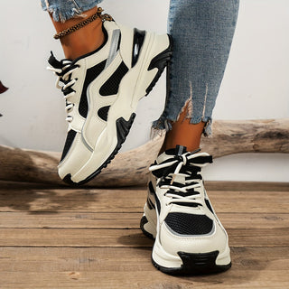 Beige women's chunky platform sneakers featuring a stylish panelled design & comfortable lace-up fit.
