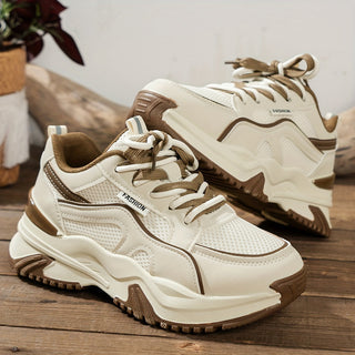 Lace-up women's panelled chunky platform sneakers, offering a fashion-forward look and secure fit.