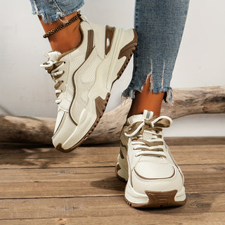Stylish women's chunky platform sneakers with a unique panelled design, ideal for casual everyday wear.