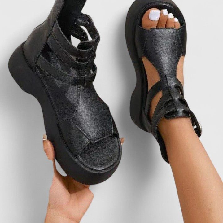 Fashionable women's open-toe platform sandals with a bold chunky sole and secure ankle strap for summer.