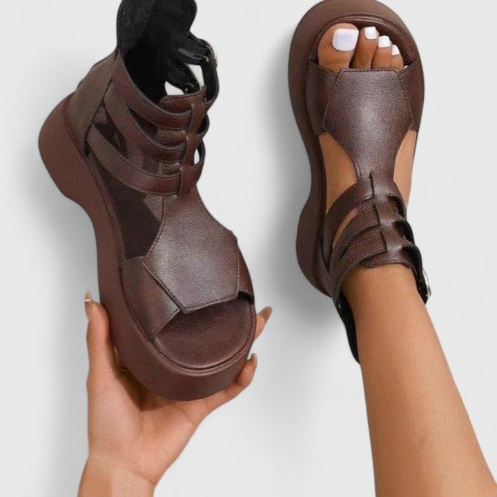 Casual women's platform sandals with a chunky sole, ankle strap, and open toe, ideal for weekend summer outfits.
