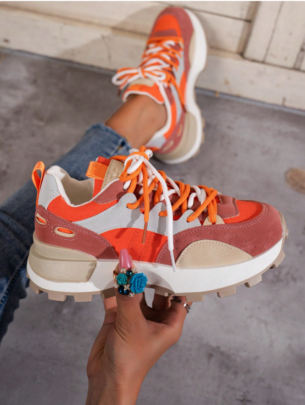 Lace-up women's chunky platform sneakers, perfect for elevated casual style. Fashion-forward footwear.