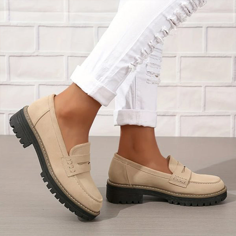 Women's chunky sole loafers with a stylish vamp strap. Comfortable and trendy flats for casual wear.