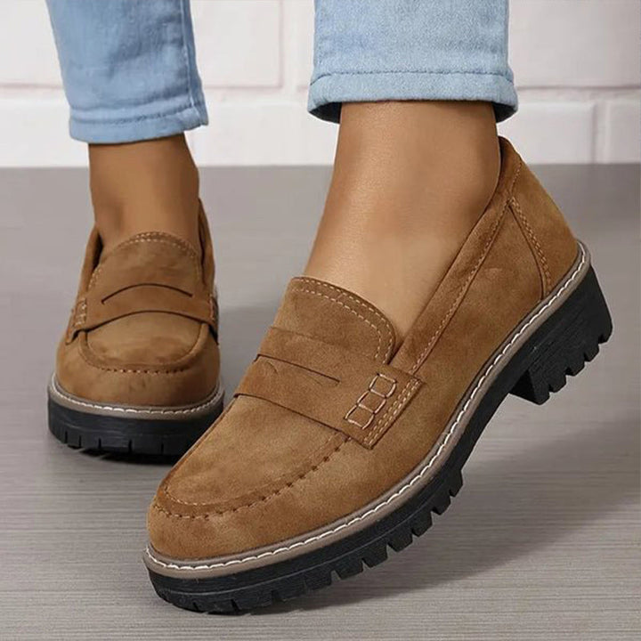 Comfortable women's chunky sole loafers, ideal for all-day wear. Features a chic vamp strap.