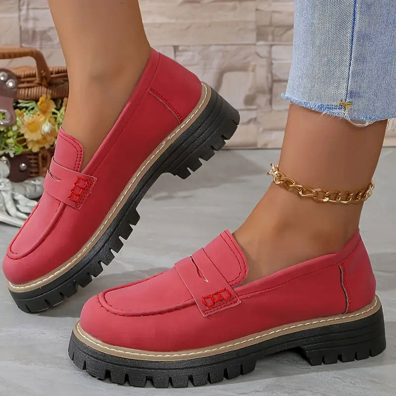 Elegant women's chunky sole loafers, featuring a prominent vamp strap. Stylish and comfortable footwear.