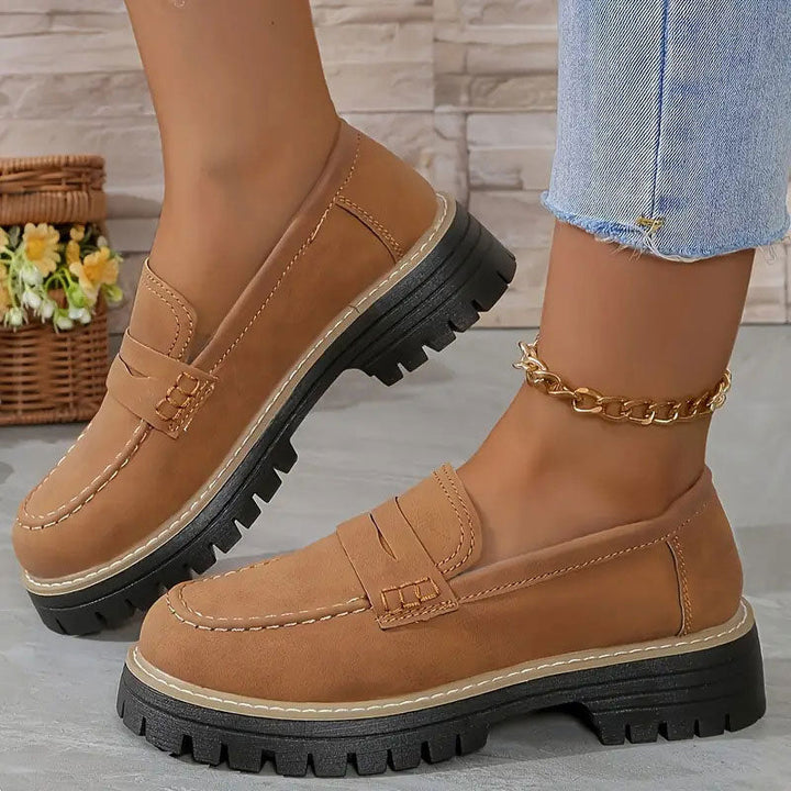 Trendy women's chunky sole loafers, designed with a classic vamp strap for modern style & comfort.