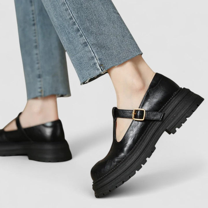 Elegant women's Mary Jane shoes with a robust chunky sole, adjustable strap, & comfortable round toe.