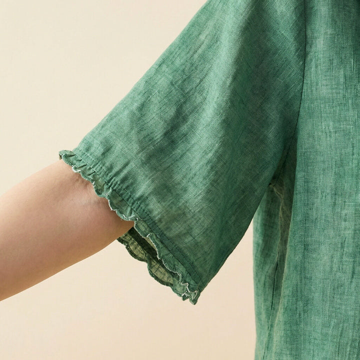 Women's short sleeve linen blend blouse, perfect for a light and airy summer look.