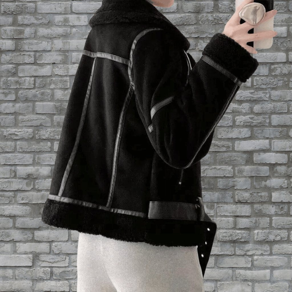 Belted women's aviator jacket with an asymmetric zip and a cozy collar. Chic and warm for chilly days.