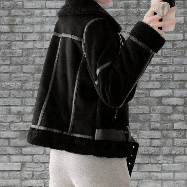 Belted women's aviator jacket with an asymmetric zip and a cozy collar. Chic and warm for chilly days.