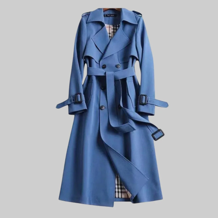 Elegant women's beige belted trench coat, featuring a classic double-breasted design for timeless outerwear.
