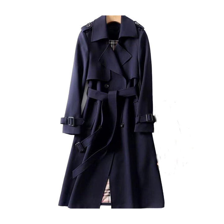 Versatile women's trench coat with belt, double-breasted. Essential fall fashion outerwear for a sophisticated look.