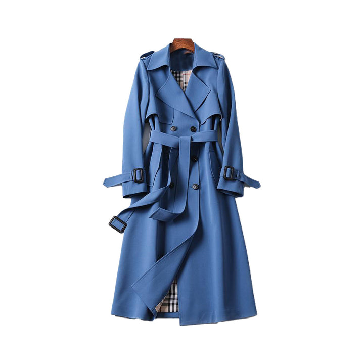 Elegant women's double-breasted trench coat, belted waist. Classic long outerwear for sophisticated autumn fashion.