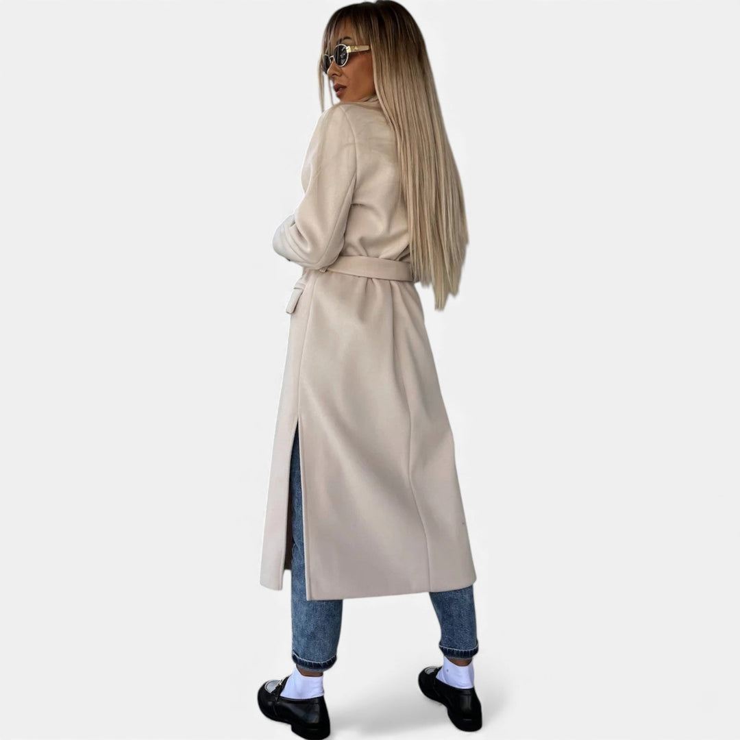 Elegant women's mid-length lapel coat with belt. A classic choice for sophisticated fall fashion.