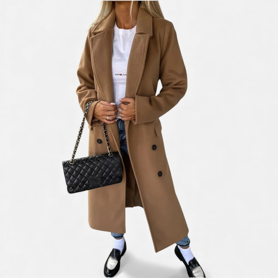 Fall/Winter women's overcoat. Mid-length, belted, and with classic lapels for an elegant look.