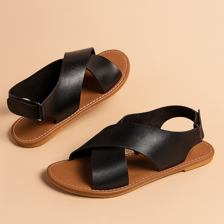 Women's classic black cross strap sandals for stylish everyday wear.