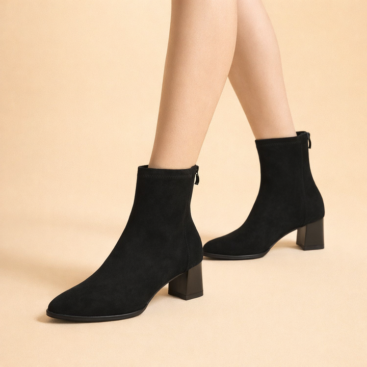 Stylish women's ankle boots, essential winter footwear for a versatile and chic cold-weather look.