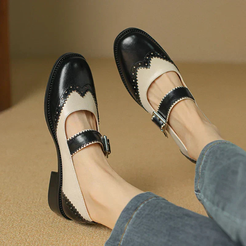 Women's classic black leather Mary Janes, perfect for everyday wear. Comfortable flat shoes with buckle strap.