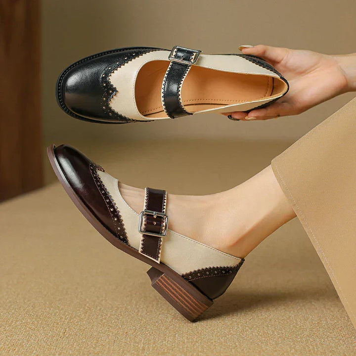 Brown leather Mary Jane flat shoes for women, offering classic style and everyday comfort with a buckle.