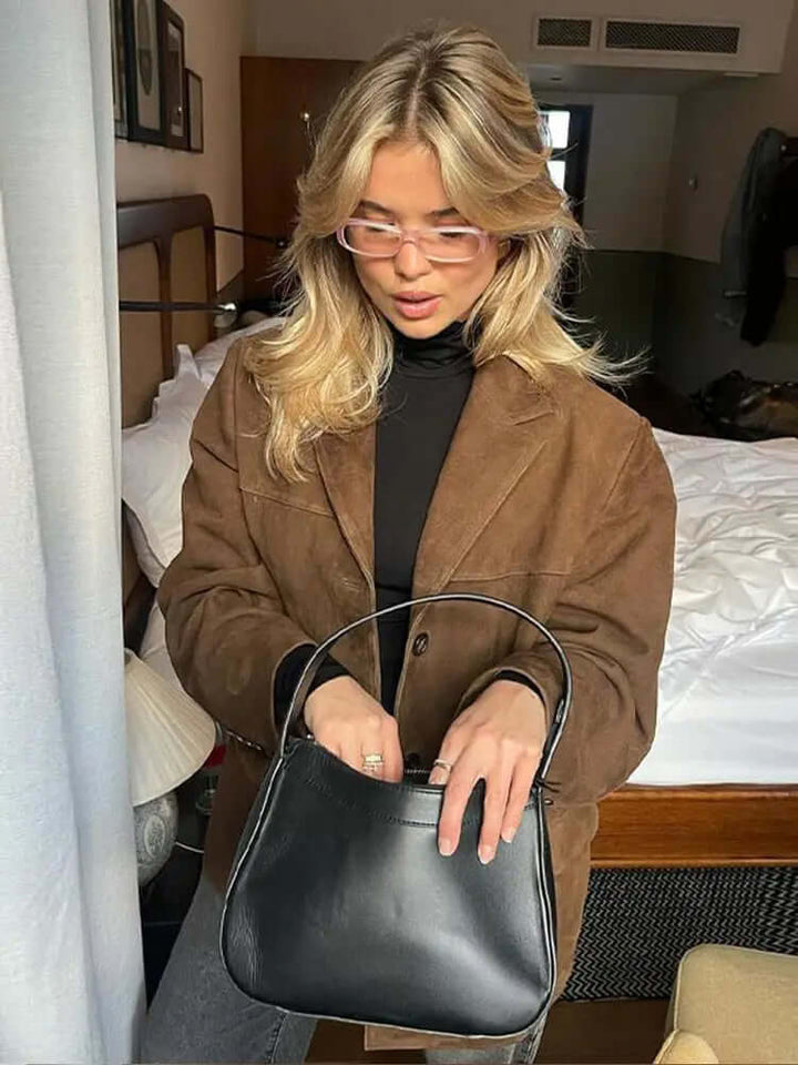 Fitted brown women's jacket with stylish zipper closure. Chic ladies outerwear for versatile fashion.