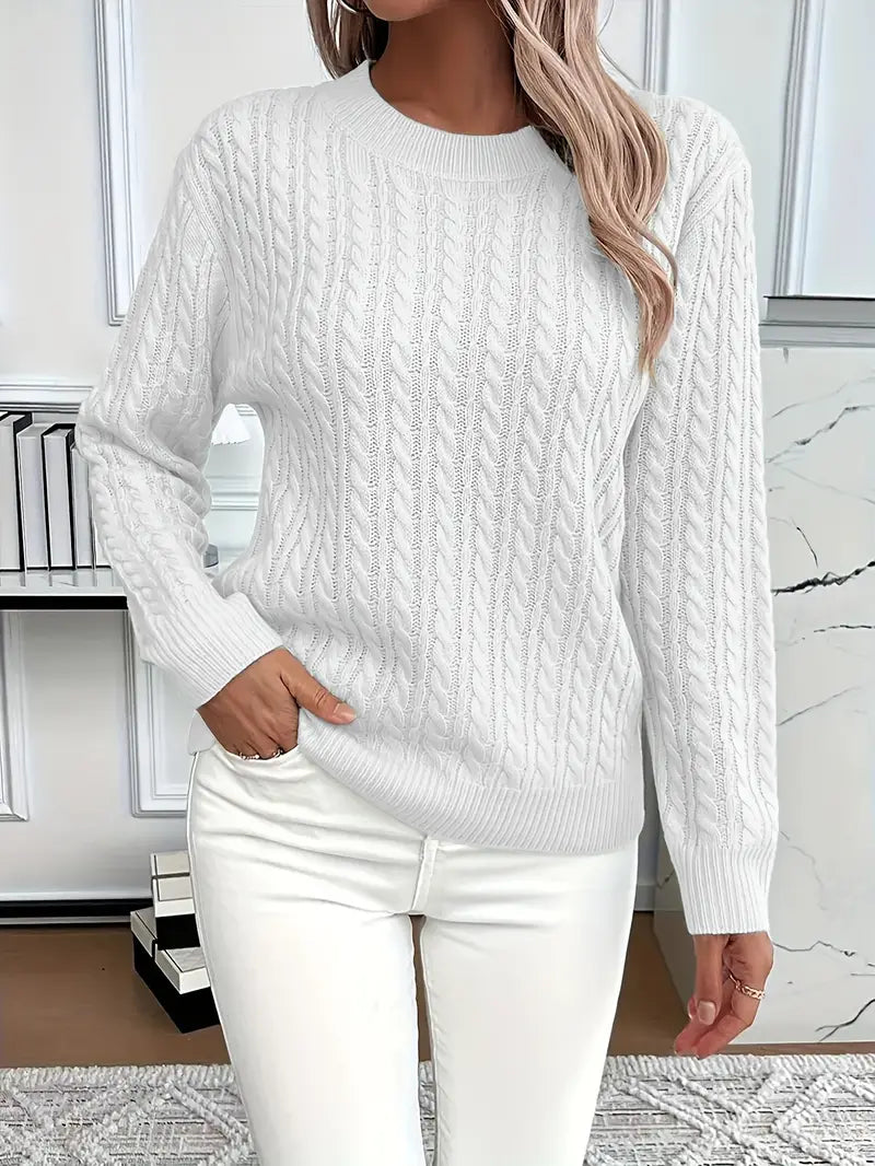 Women's classic cable knit jumper, a timeless and cozy knitted sweater perfect for winter fashion.