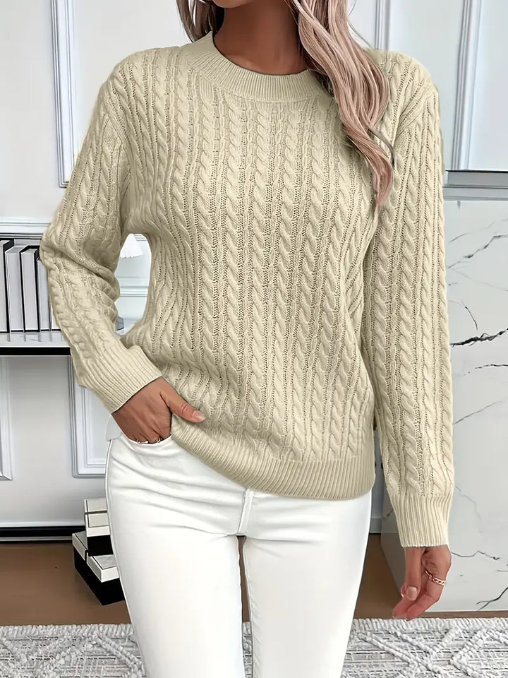 Timeless ladies' cable knit jumper. Cozy and warm knitted sweater, perfect for classic everyday winter style.