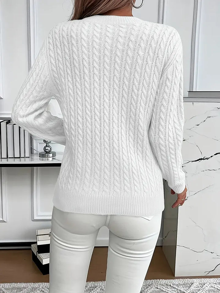 Cozy cable knit women's jumper. Warm knitted sweater with classic design for ladies' everyday casual wear.