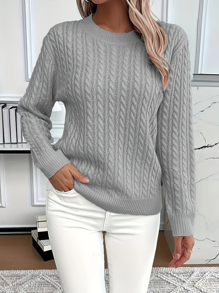 Classic women's cable knit jumper. Versatile, long-sleeve knitted sweater for casual and cozy winter fashion.