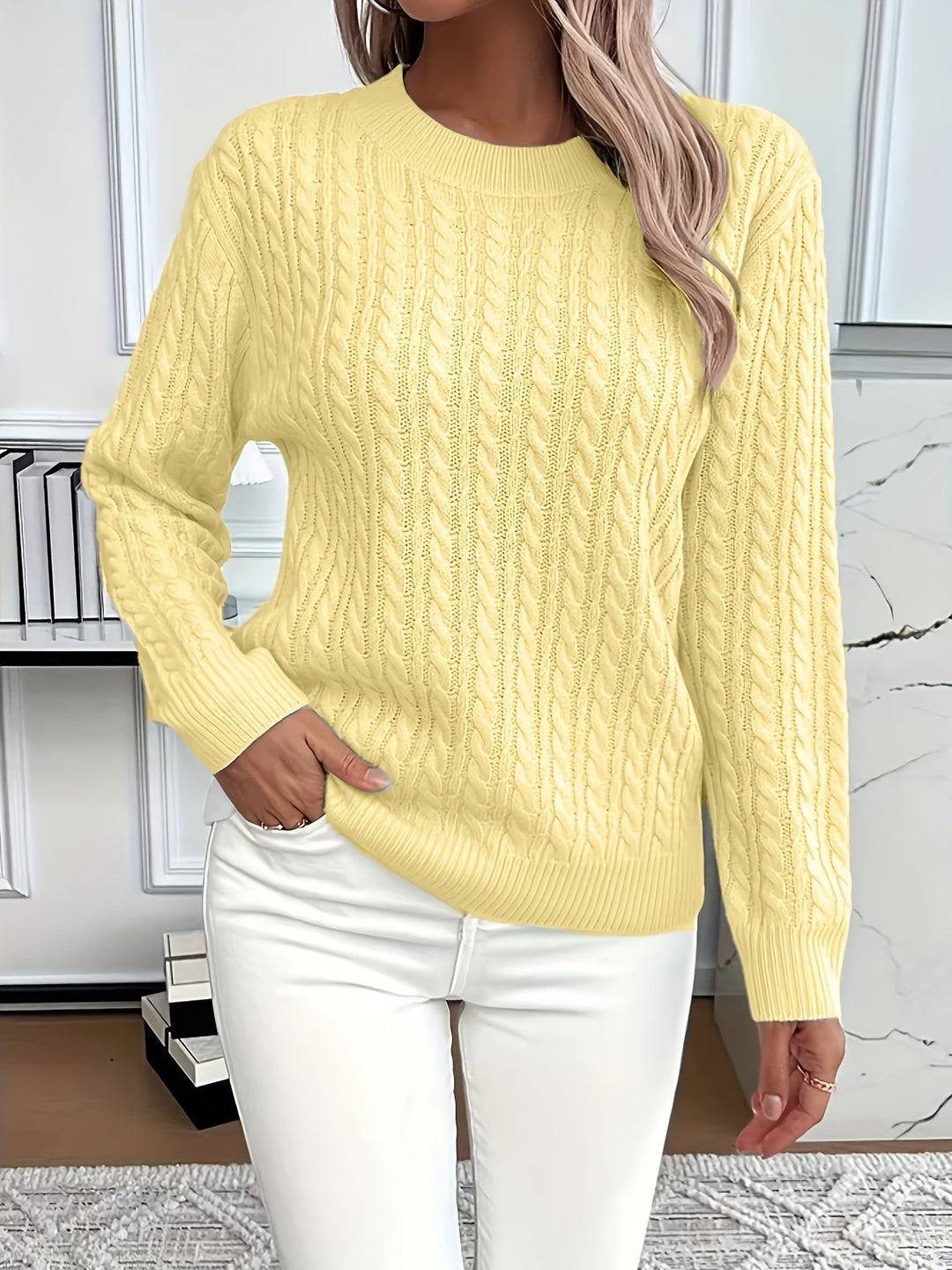 Soft and warm cable knit women's jumper. Cozy knitted pullover, perfect for comfortable winter fashion.