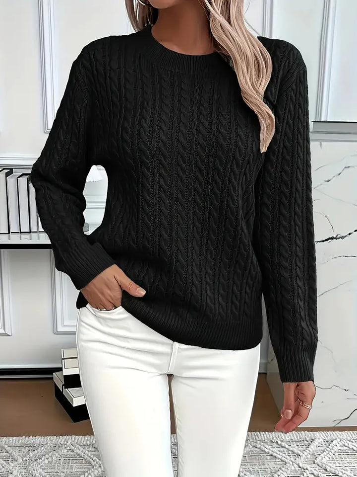 Stylish women's cable knit jumper, a warm and cozy knitted sweater perfect for classic winter fashion.