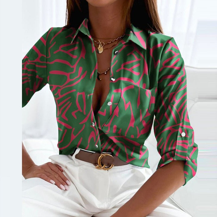 Model in office, wearing a women's chic collared printed blouse. Suitable for professional workwear & versatile fashion.