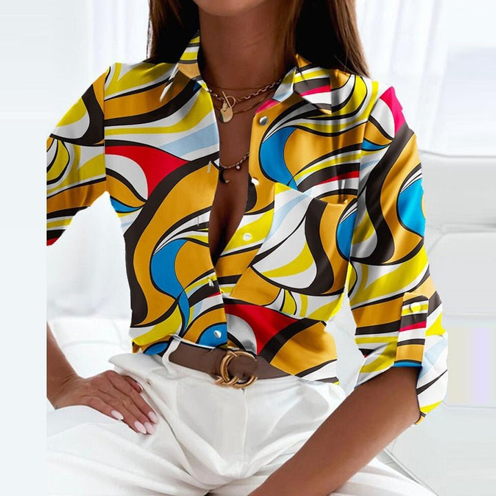 Women's classic printed blouse, tucked into a skirt. Illustrates adaptable smart casual style & versatile workwear.