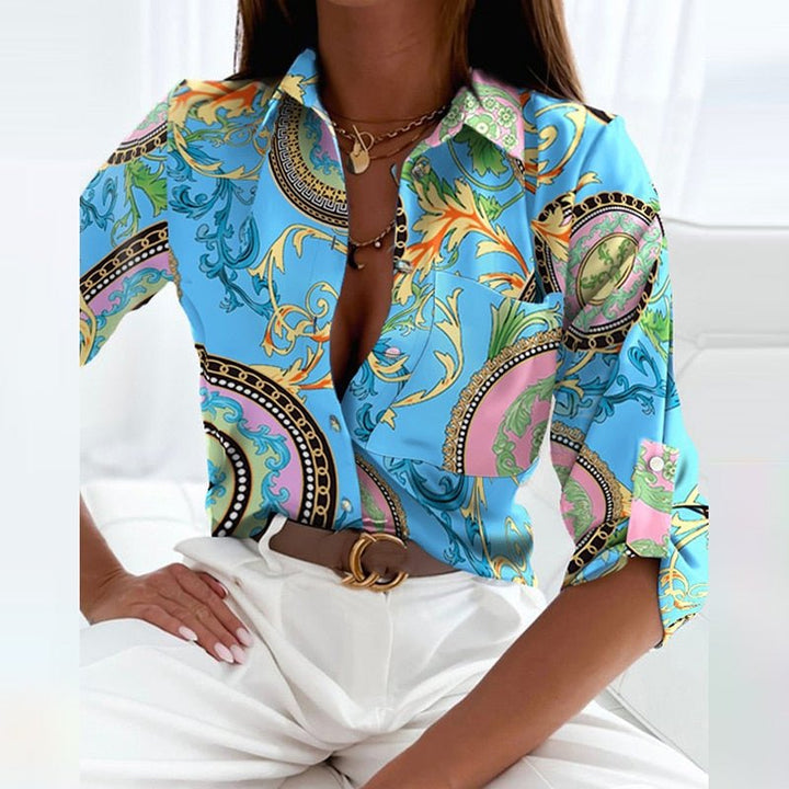 Fabric texture close-up of a women's printed blouse. Emphasizes quality, comfortable feel & versatile fashion.