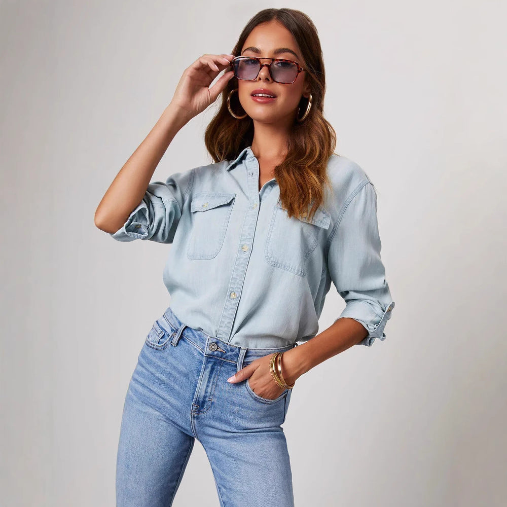 Stylish women's classic denim shirt. Button-down, long sleeve top for a chic, casual look.
