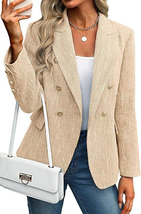 Chic women's fashion blazer, double-breasted with decorative buttons, ideal for any elegant occasion.