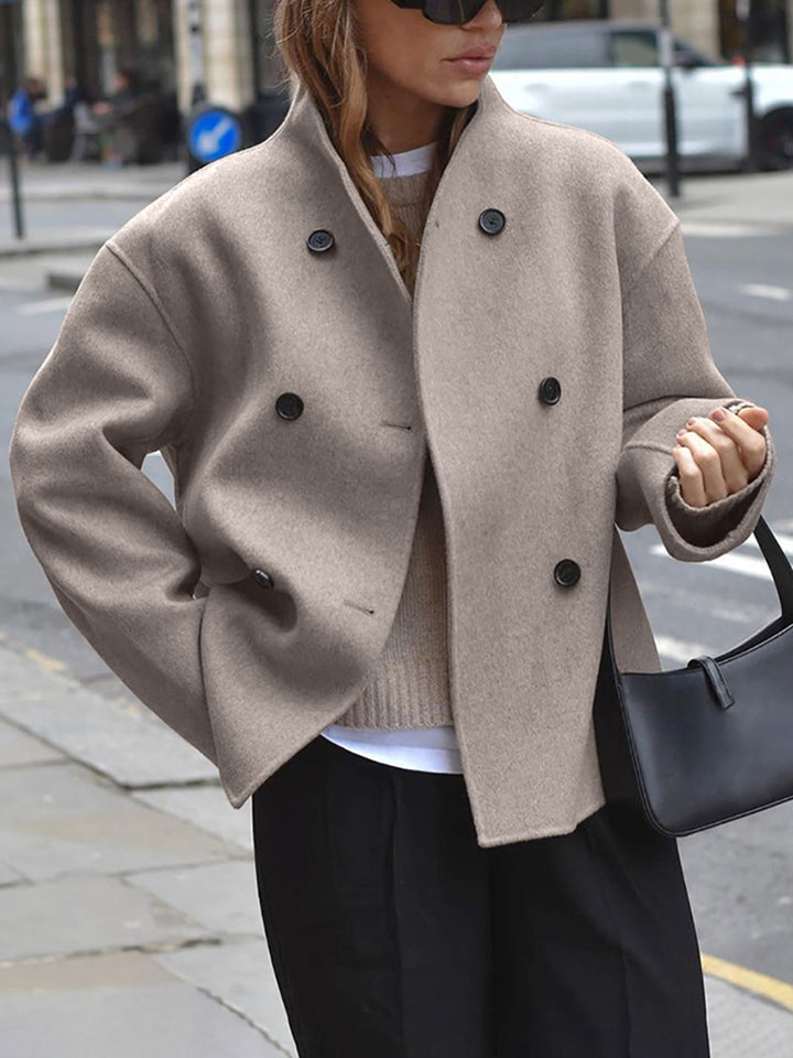 Women's classic double breasted pea coat, ideal for winter warmth & style.