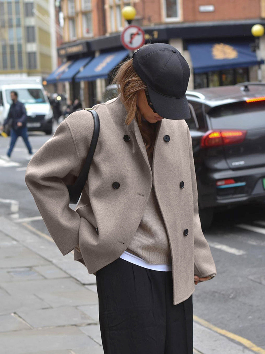 Stylish women's double breasted pea coat with stand collar & button front, perfect winter outerwear.