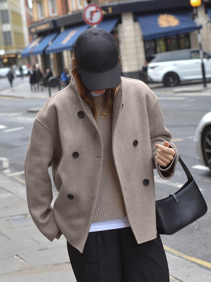 Warm women's pea coat, double breasted design for classic winter fashion & outerwear.
