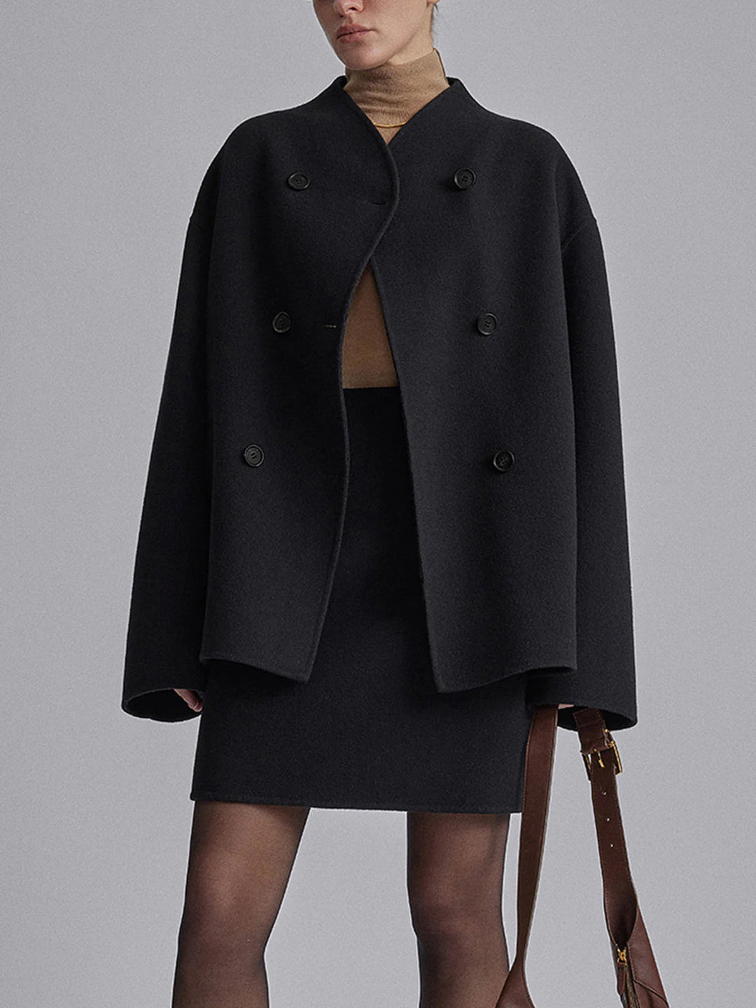 Women's warm pea coat with a sophisticated stand collar & double-breasted button front.