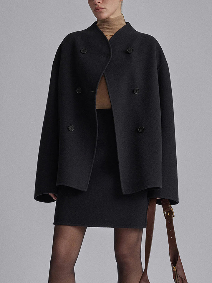 Women's warm pea coat with a sophisticated stand collar & double-breasted button front.