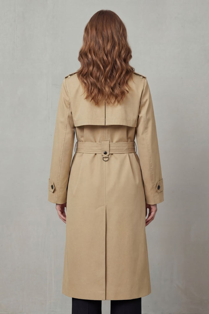 Elegant woman wearing a long double-breasted trench coat. Perfect for stylish layering in spring or fall.